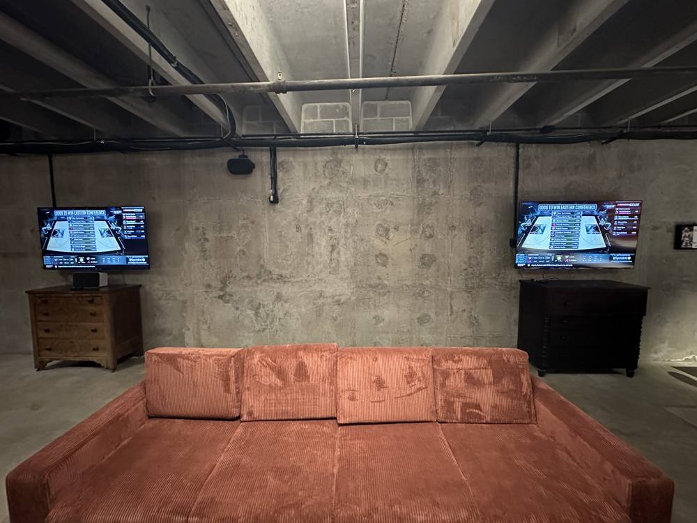 Both 60 inch TVs showing the same feed
