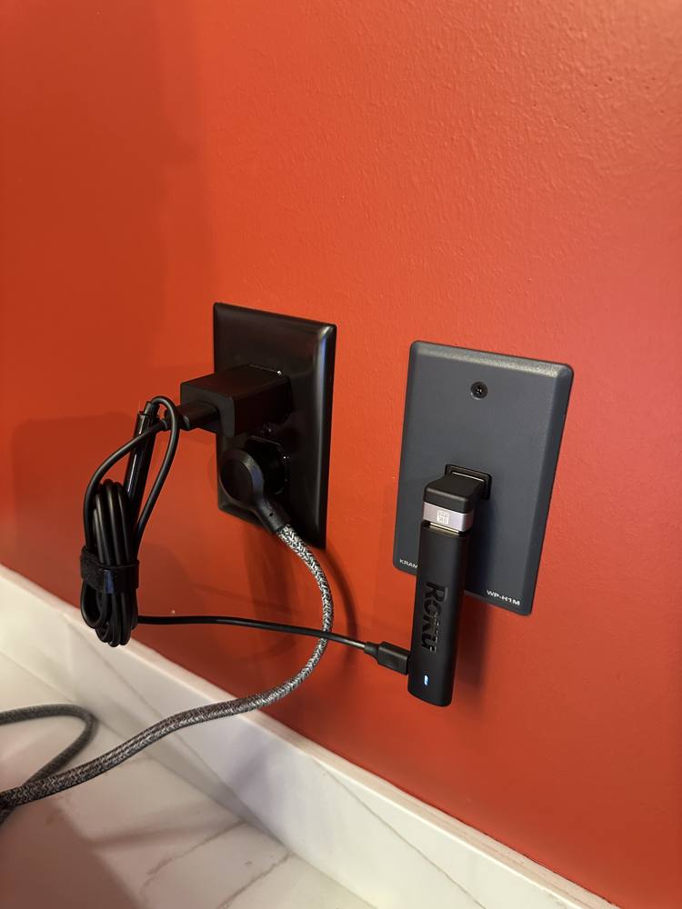 Roku stick plugged into the HDMI wall plate