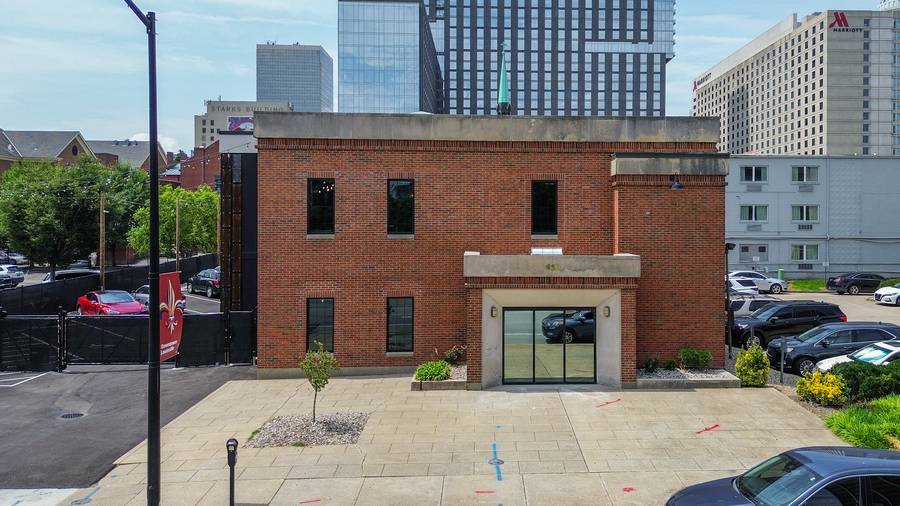 Look for the brick building with a tree in the plaza