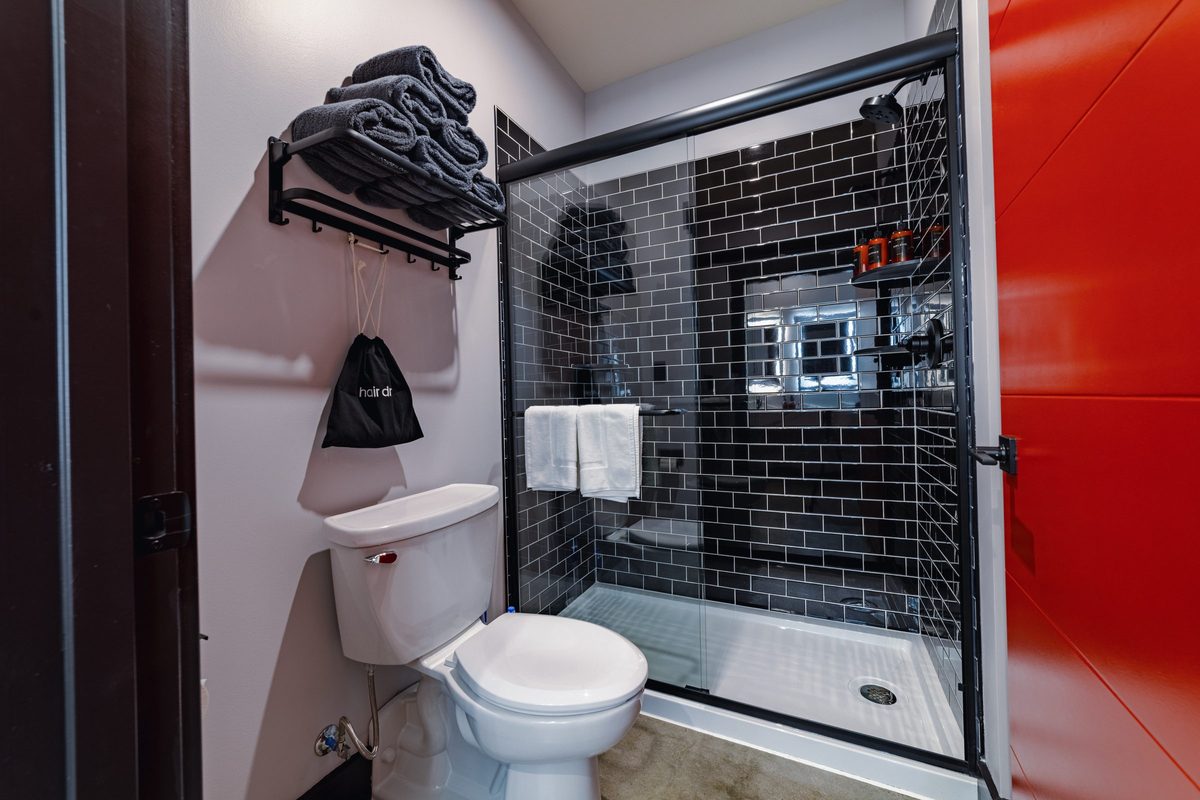 Suite bathroom with subway tile shower