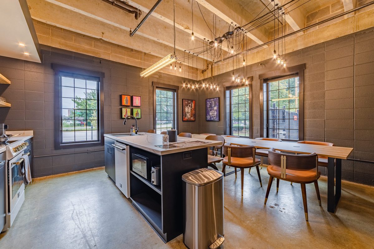 Suite dining table under pendant lights
