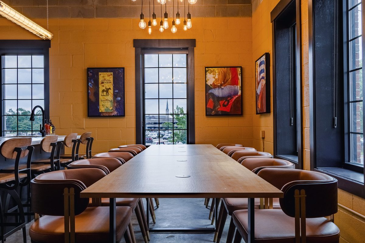 Crown suite long dining table under pendant lights